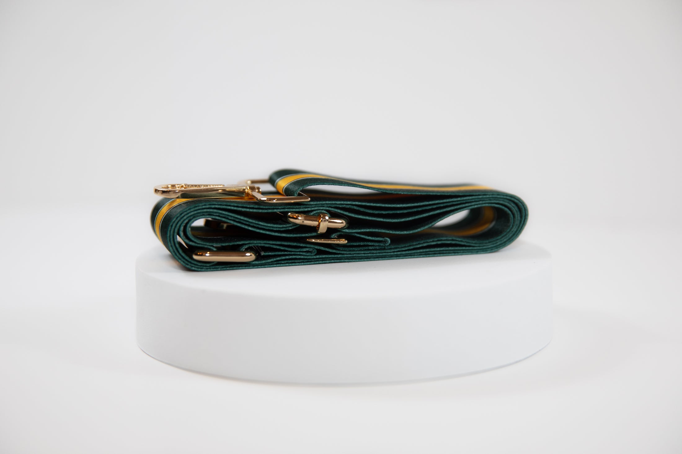 Elegant crossbody strap shown in Green Bay Packers green and gold team colors