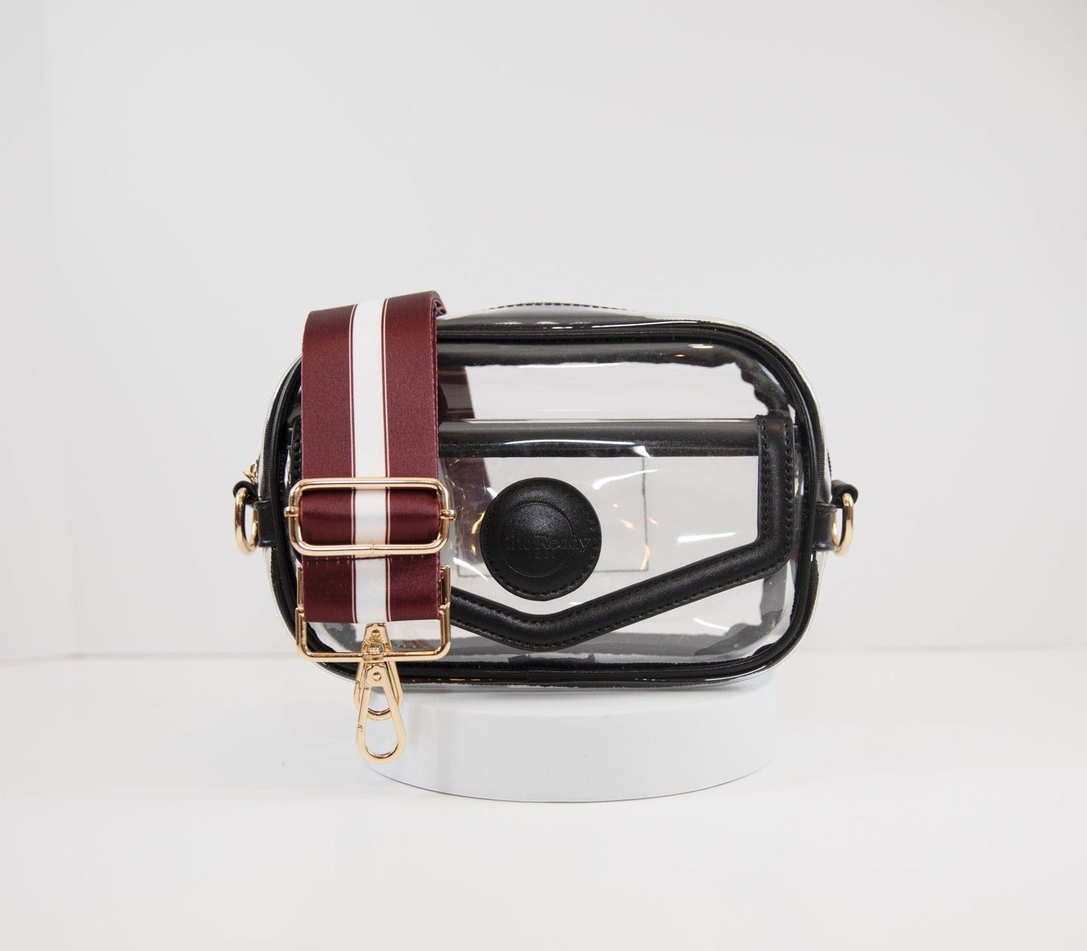 Clear stadium bag in black leather trim, front facing, with a crossbody strap in the team colors of Texas A&M.