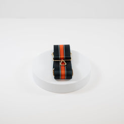 Elegant crossbody strap shown in Chicago Bears team colors