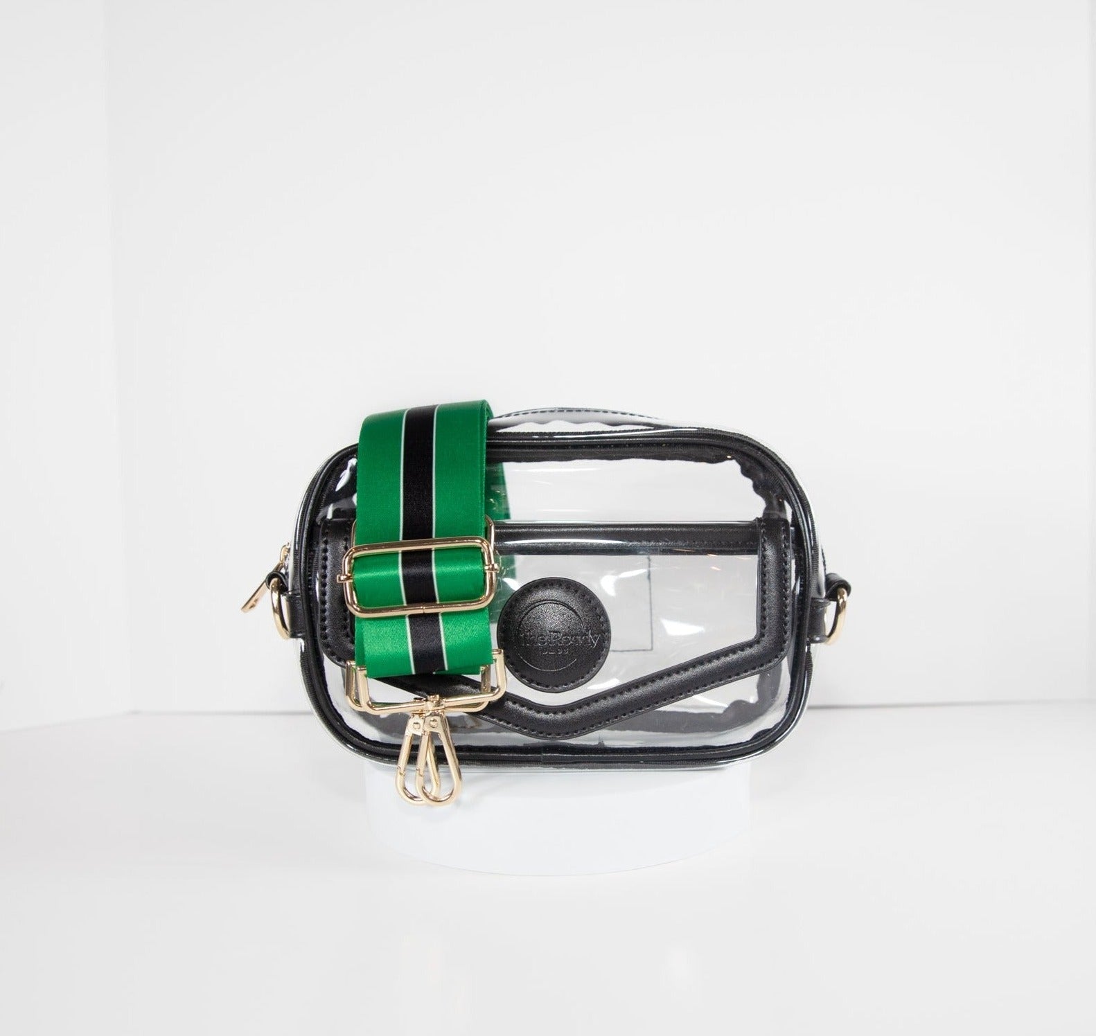 Clear stadium bag with black leather trim, front facing, with a crossbody strap in Philadelphia Eagles colors.