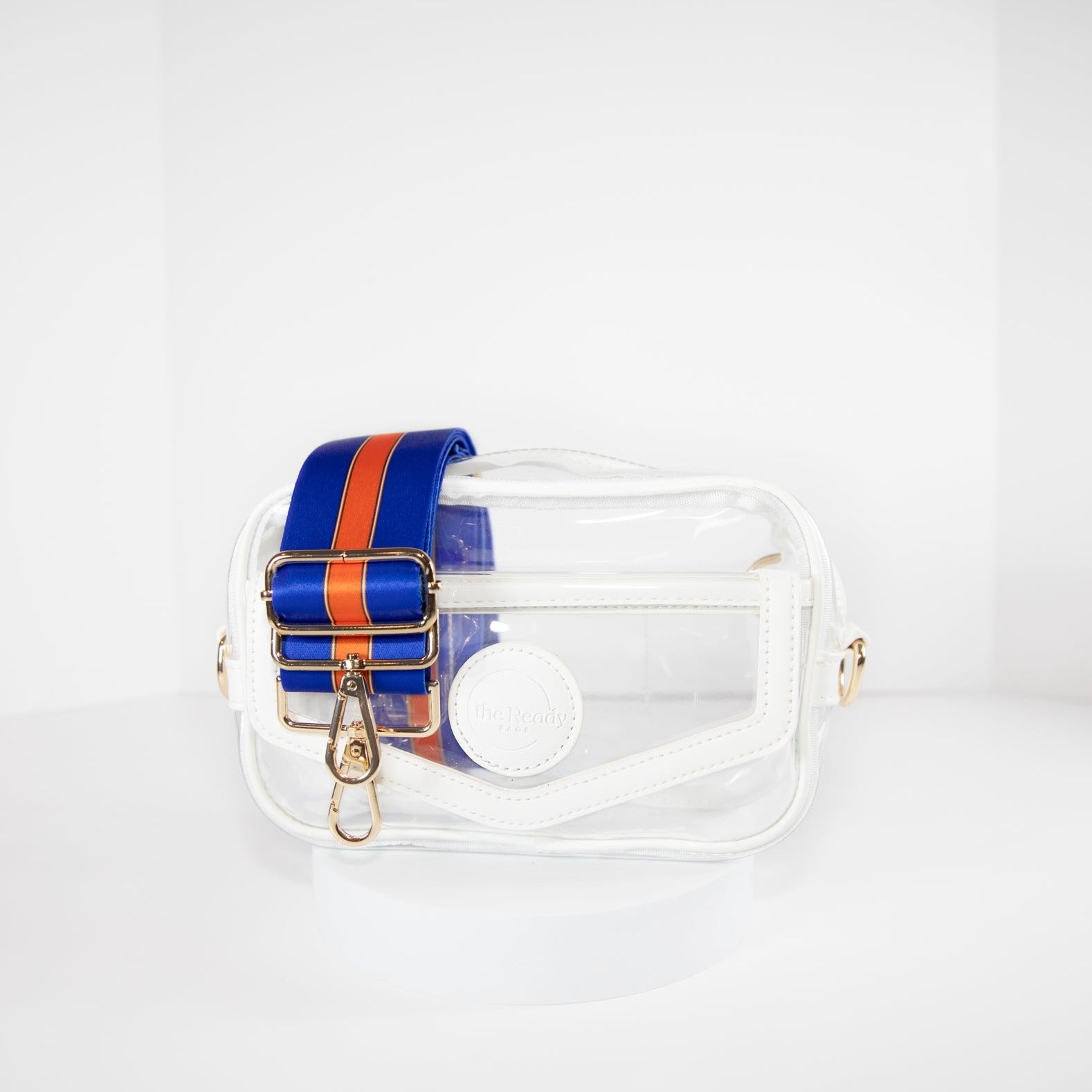 Clear stadium bag in white leather trim, front facing, with a crossbody strap in University of Florida Gators team colors.