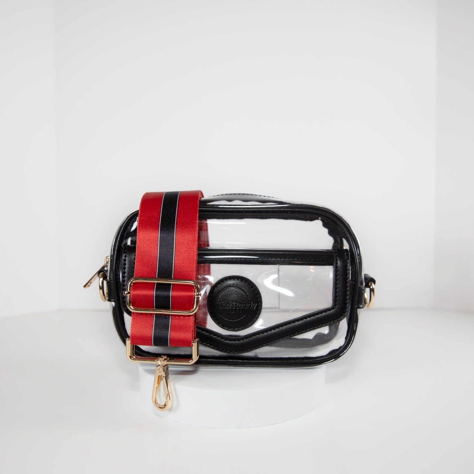 Clear stadium bag with black leather trim, front facing, with a crossbody strap in team colors of the Georgia Bulldogs.