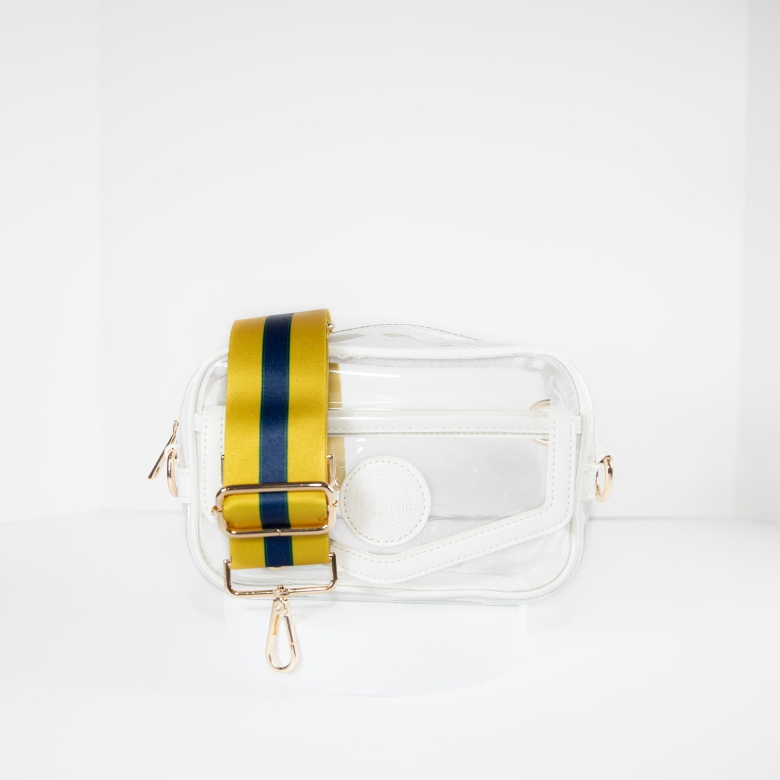 Clear stadium bag in white leather trim, front facing, with a crossbody strap in Notre Dame Fighting Irish team colors.