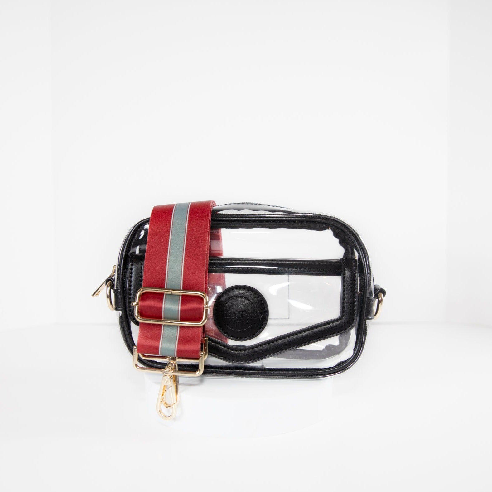 Clear stadium bag with black leather trim, front facing, with a crossbody strap in team colors of Alabama Crimson Tide.