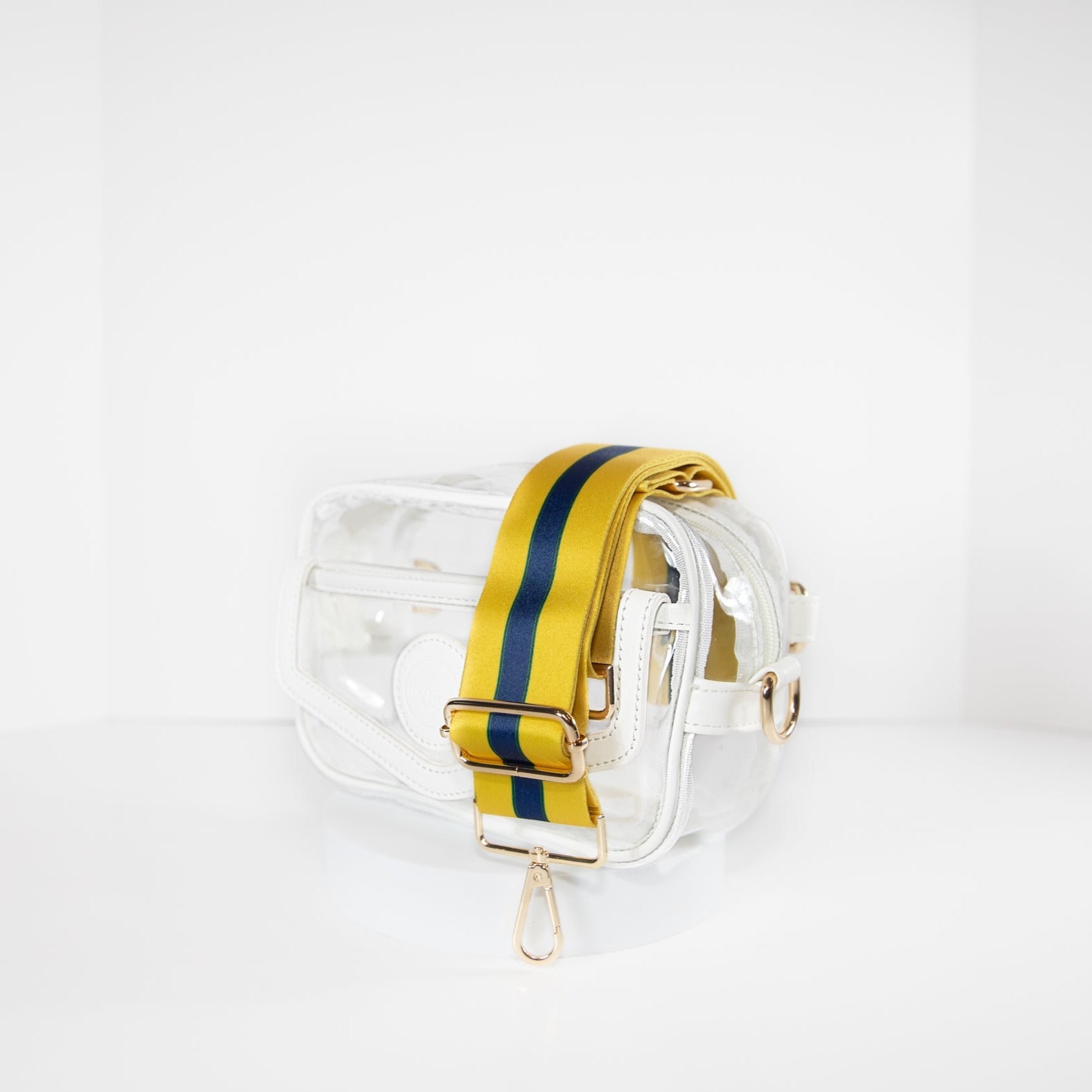 Clear stadium bag in white leather trim, side facing, with a crossbody strap in Notre Dame Fighting Irish team colors.