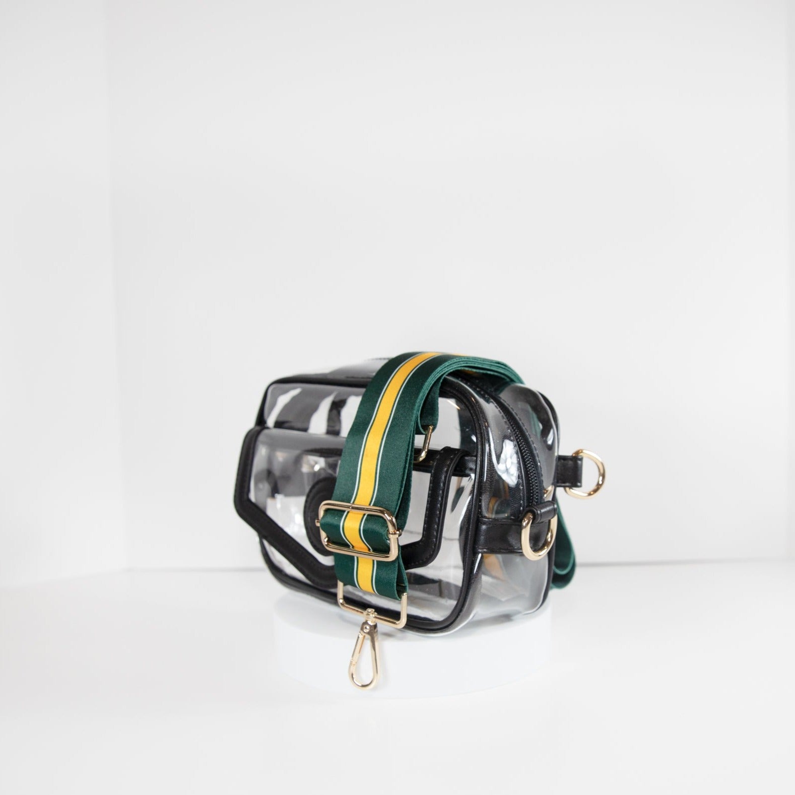 Clear Stadium Bag in black leather trim, side facing, with a strap in the team colors of the Green Bay Packers.