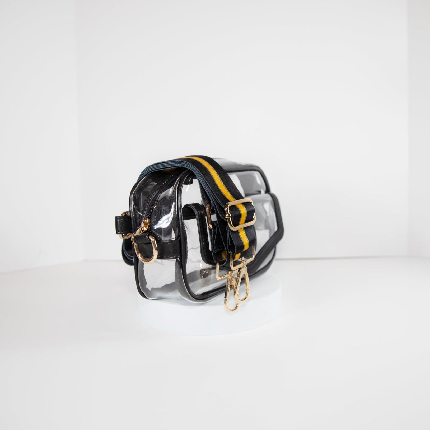 Clear stadium bag in black leather trim, side facing, with a crossbody strap in Pittsburgh Steeler black and gold.